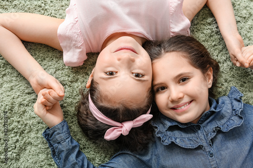 Portrait of cute twin girls...