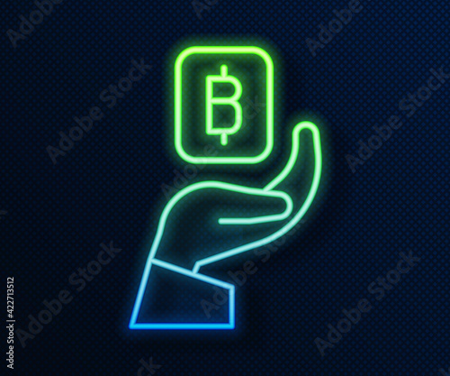 Glowing neon line Hand holding Bitcoin icon isolated on blue background. Blockchain technology, digital money market, cryptocoin wallet. Vector