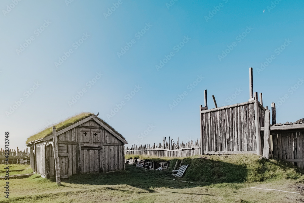 An abandoned vikings village. Sod rooftops, turf rooftops. Village located at the bottom of a high mountain in Iceland