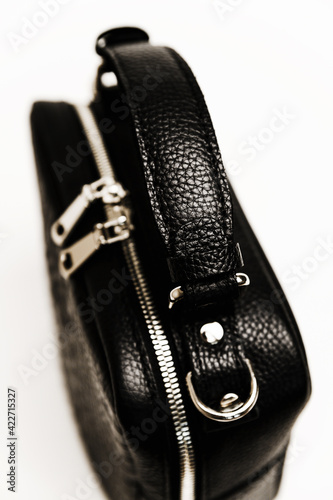 beautiful urban womens handbag. black handbag with texture on the skin. expensive womens handbag on a white background.