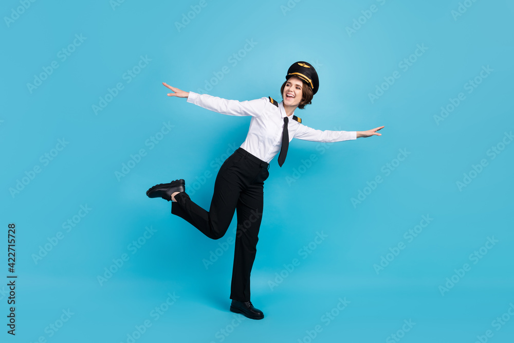 Full size photo of optimistic nice brunette hair lady show plain wear pilot uniform isolated on blue background