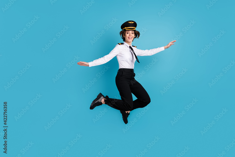 Full body photo of excited positive young woman jump up air isolated on pastel blue color background