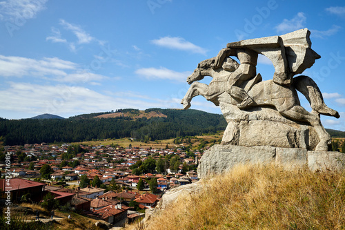 View of the historic village of Koprivshtitsa and the monument of the freedom fighter Benkovski, Bulgaria photo