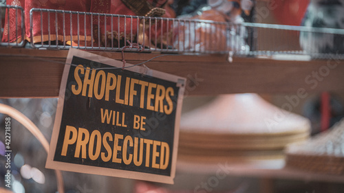 Shoplifters will be prosecuted sign