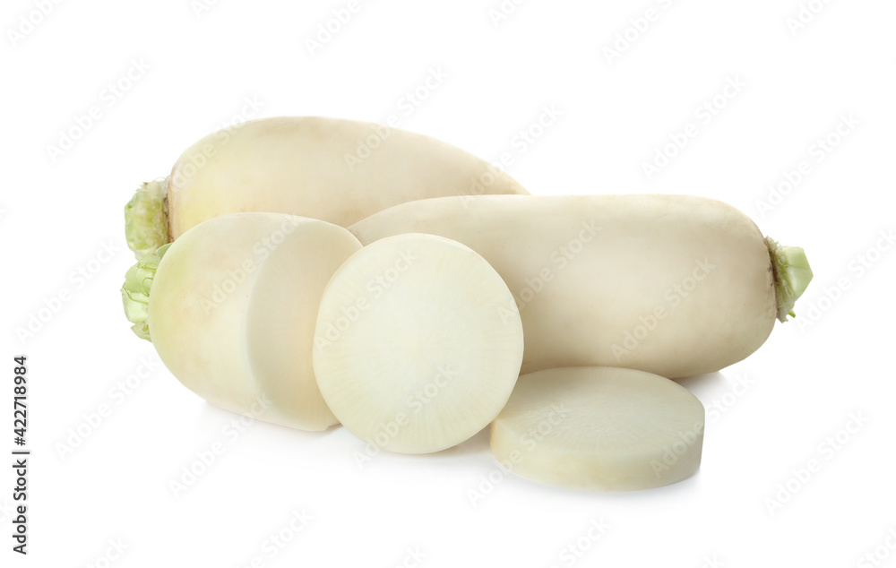 Sliced and whole fresh ripe turnips on white background