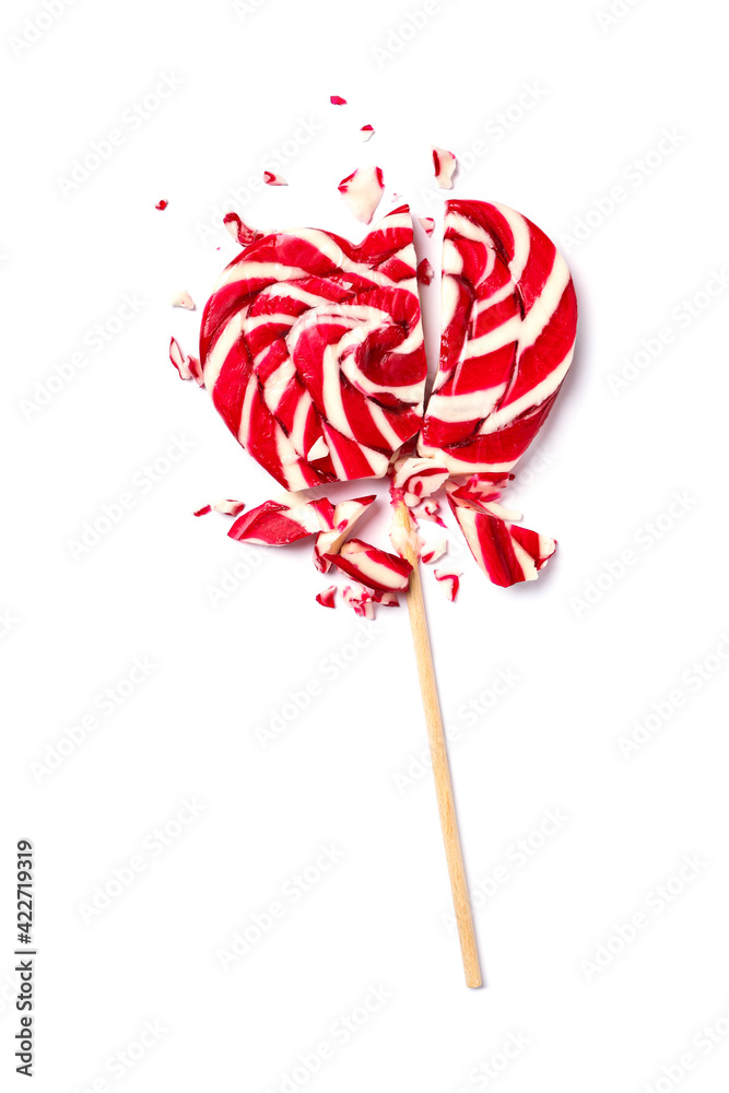 Broken heart shaped lollipop isolated on white, top view. Relationship problems concept Broken heart shaped lollipop isolated on white, top view. Relationship problems concept