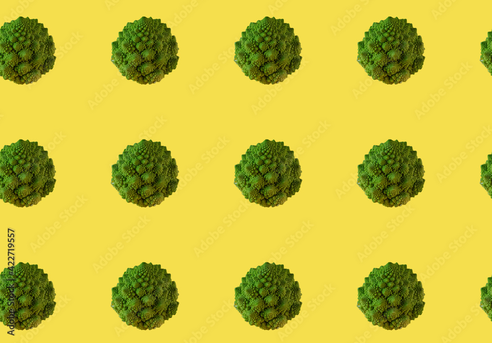 Seamless pattern of Romanesco broccoli. green vegetables on the yellow background Seamless pattern of Romanesco broccoli. green vegetables on the yellow background