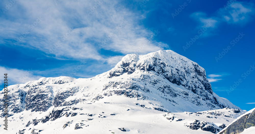 Spectacular view of a snow capped mount Bitihorn peak in Beitostølen in Norway on a sunny winters day.