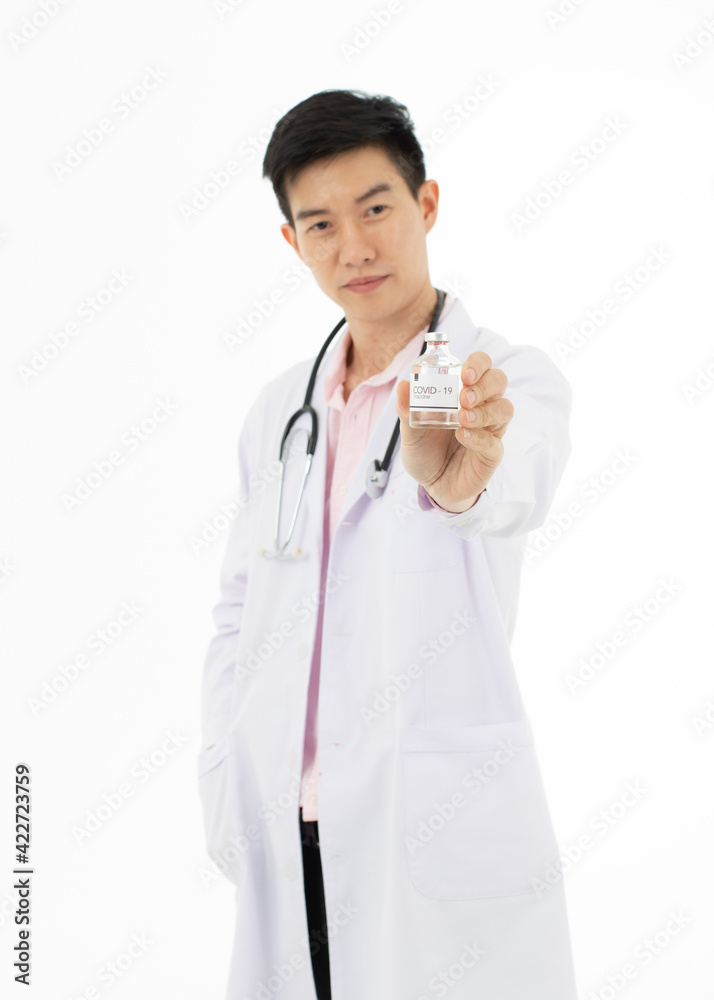 Portrait of Asian male doctor in white gown coat holding a bottle of coronavirus covid-19 vaccine in hand pose on white background. Portrait of Asian male doctor in white gown coat holding a bottle of coronavirus covid-19 vaccine in hand pose on white background.
