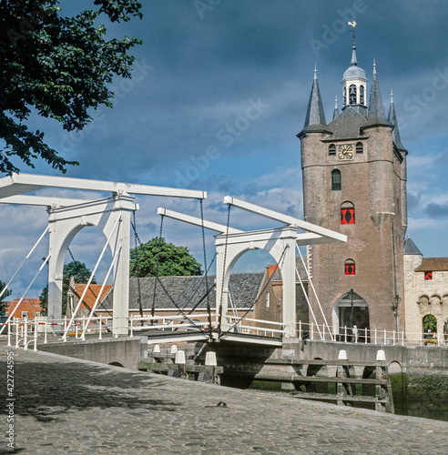 Zierikzee Medieval tower and gate to the town. Canal and drawbridge. Zeeland Netherlands. 1990's