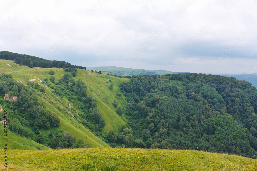 Marvellous view of slopes, meadows and forests in foothills of North Caucasus.