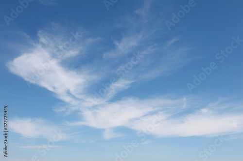 Bright white clouds over blue sky