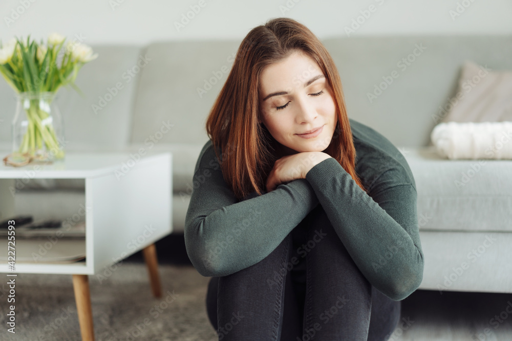 Young woman enjoying a quiet relaxing moment of quality time