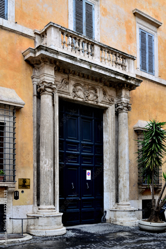 entrance to the old house house with stone frame - Rome, Italy