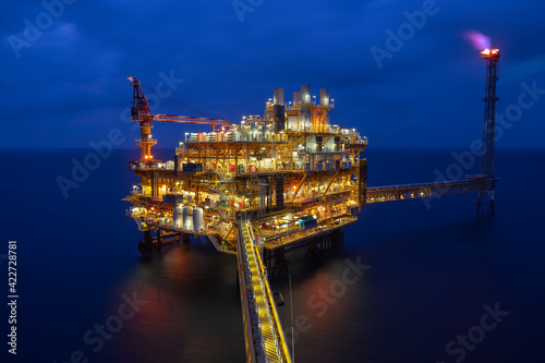 Offshore production platform in petroleum industry in the night