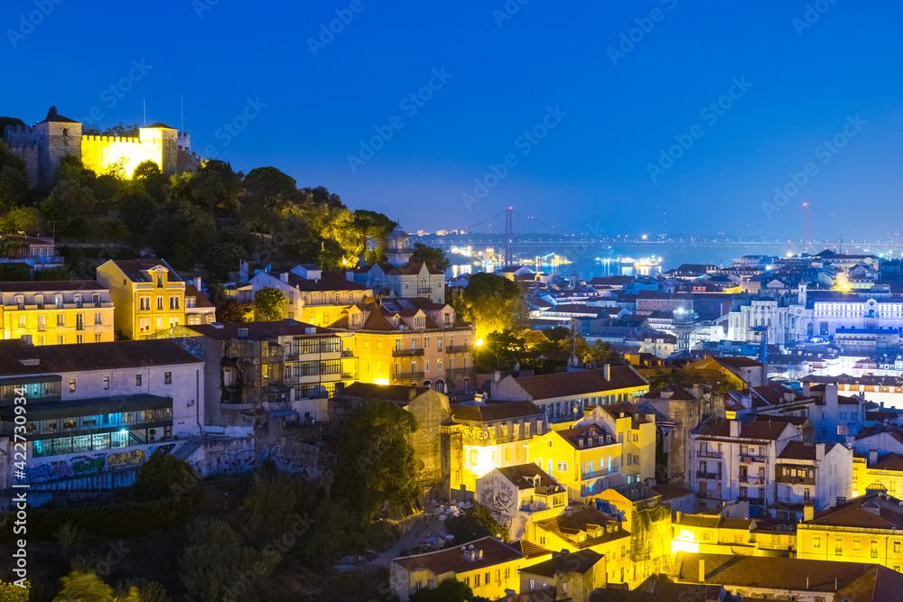 Naklejka premium Aerial view of Lisbon, Portugal at sunrise with view over old Alfama and castle
