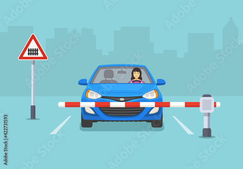 Happy female driver is driving a new modern blue sedan car. Car is reaching the railroad cross with barrier. Isolated flat vector illustration template.
