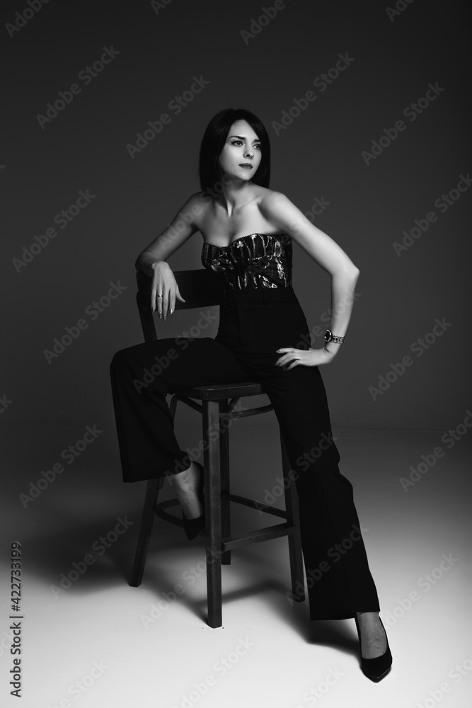 Fototapeta premium portrait of a brunette girl in a corset and pants