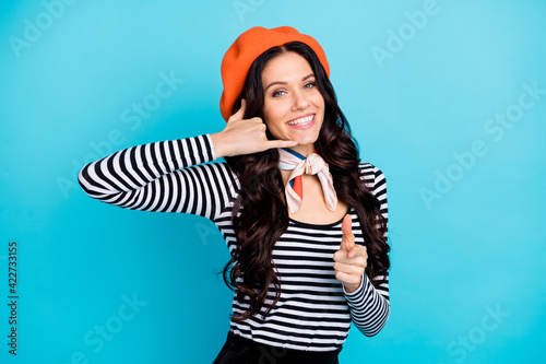 Portrait of curly hairstyle attractive lady hand show phone symbol finger direct you isolated on blue color background