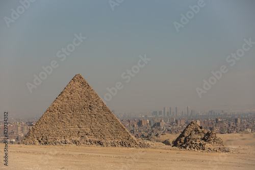 Panoramic view of Giza plateau and city of Cairo in the background.