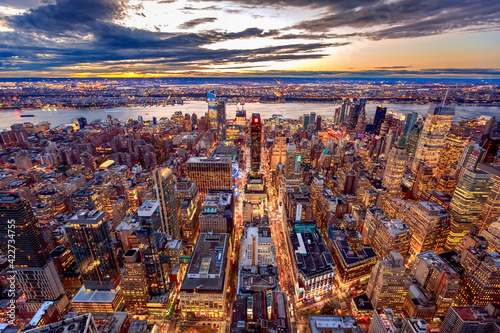 New York City Manhattan sunset skyline aerial view with office building skyscrapers and Hudson River. photo