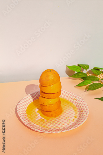 Studio shot of squeezed oranges at vintage scene