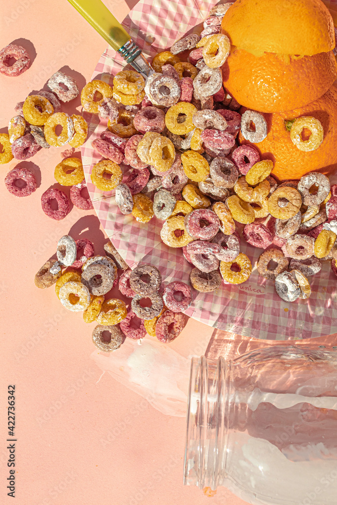 Top view of desastrous breakfast with colors cereals and milk