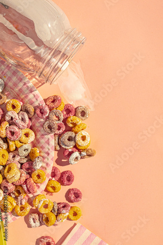 Top view of desastrous breakfast with colors cereals and milk