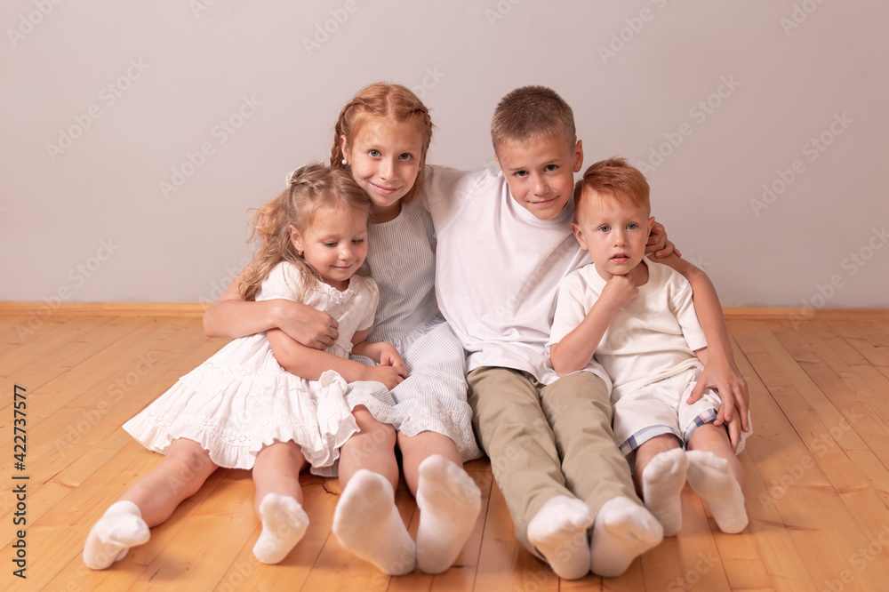 brothers and sisters. children hug. 4 children. large family brothers and sisters. children hug. 4 children. large family