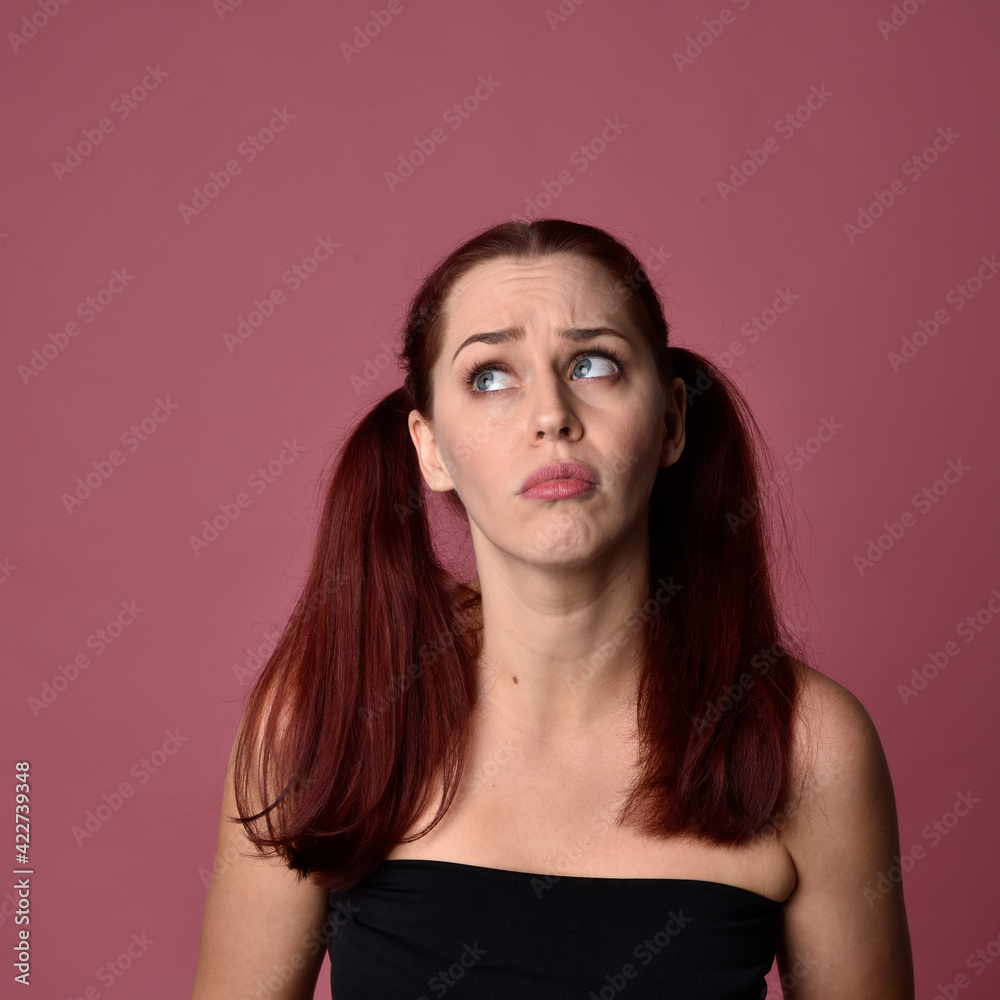 close up portrait of red haired women with different facial expressions on a pink studio background.