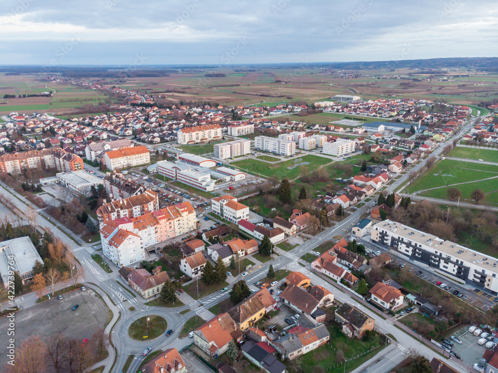 City Koprivnica, Croatia. Panoramic drone photos of the city center taken during the sunset in the winter. View on the city street, park and church.