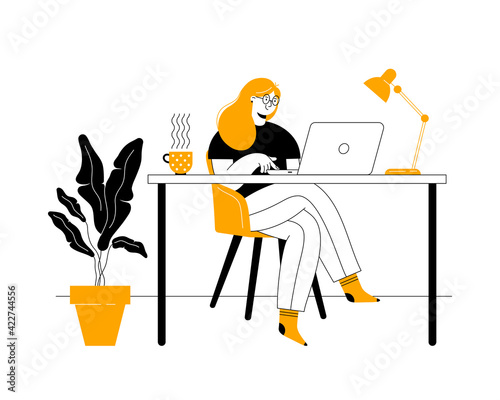 Young woman freelancer working from home. Remote work or distance learning, home office.