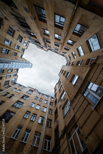 The yard is a well in St. Petersburg. Bottom view. Stone walls going up. The central part of St. Petersburg.