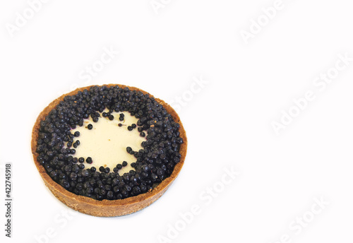 Classic New York cheesecake with blueberries on a white plate. Cake closeup