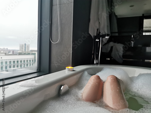 The girl takes a bath. Rest and relaxation, spa treatments.