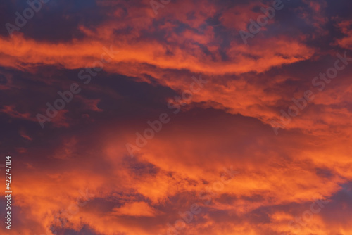 Majestic dramatic burning sky during sunset for background