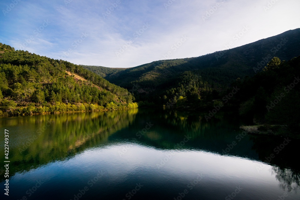 landscape of a water dam, forest and mountains in Las Hurdes.