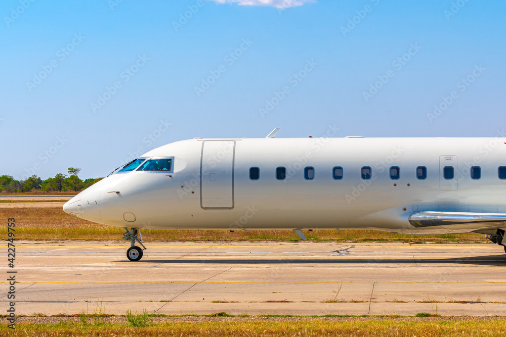 Close up of passenger airplane parked in airport Close up of passenger airplane parked in airport