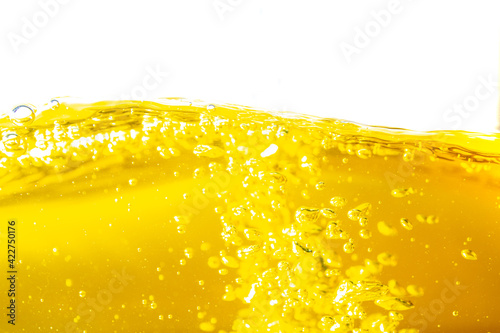 Water wave with bubble of air, on white background. Yellow water
