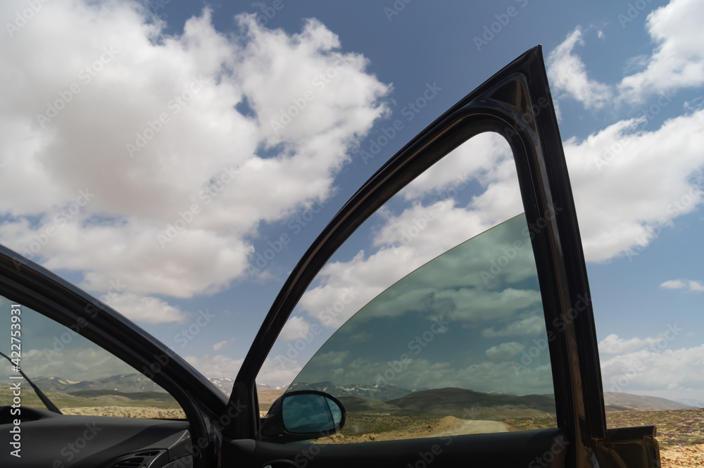 Fototapeta premium Sky view from car window and cloudy sky