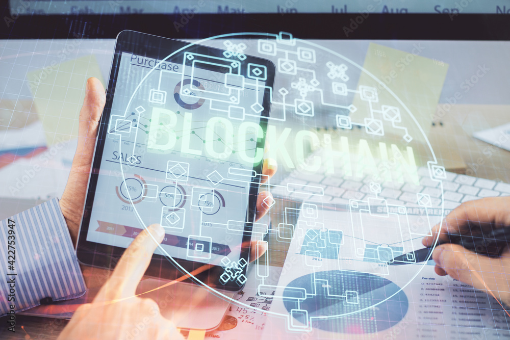 Double exposure of man's hands holding and using a phone and crypto currency blockchain theme drawing. Double exposure of man's hands holding and using a phone and crypto currency blockchain theme drawing.