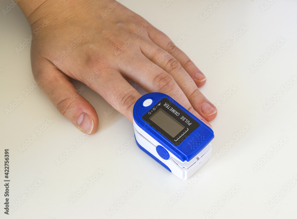 Pulse oximeter on the patient's hand Pulse oximeter on the patient's hand