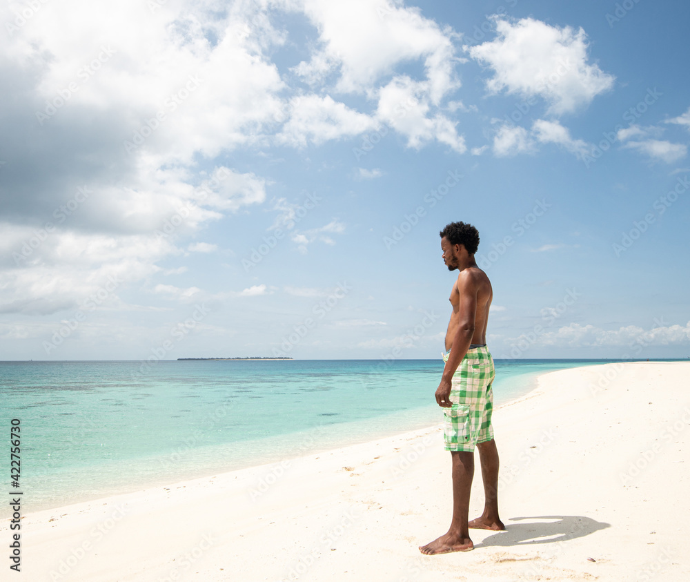 Young black African man on beautiful beach sea Young black African man on beautiful beach sea