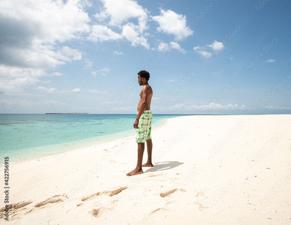 Young black African man on beautiful beach sea