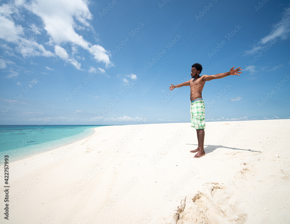 Young black African man on beautiful beach sea Young black African man on beautiful beach sea