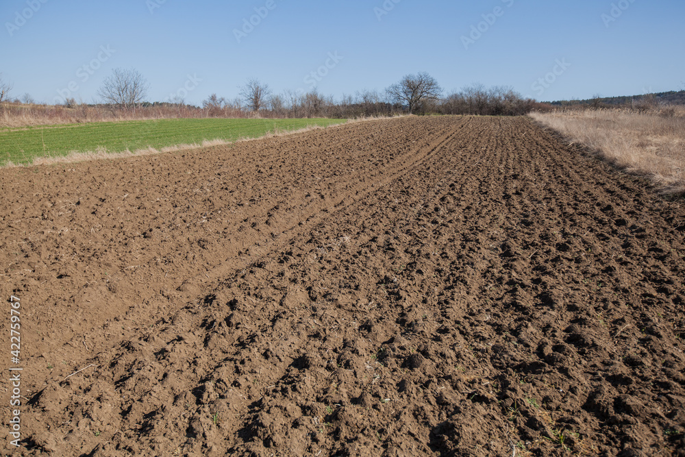 Rural agricultural landscape of the ploughed field Rural agricultural landscape of the ploughed field