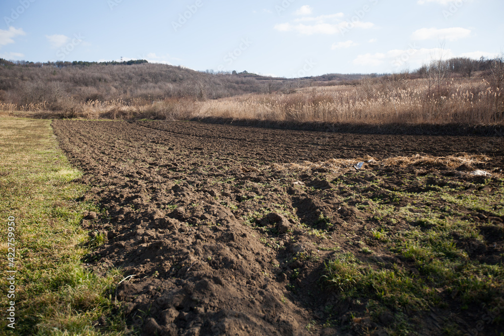 Rural agricultural landscape of the ploughed field