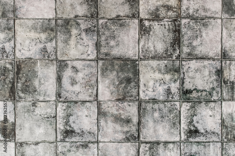 Dark gray square ceramic floor tiles with abstract pattern, mosaic texture background Dark gray square ceramic floor tiles with abstract pattern, mosaic texture background