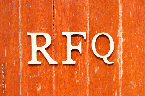 Alphabet letter in word RFQ (abbreviation of request for quotation) on old red color wood plate background photo