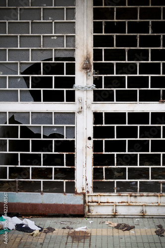 old iron door with broken window